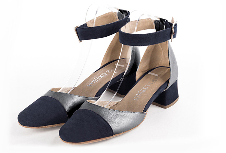 Navy blue and dove grey women's open side shoes, with a strap around the ankle. Round toe. Low flare heels. Front view - Florence KOOIJMAN